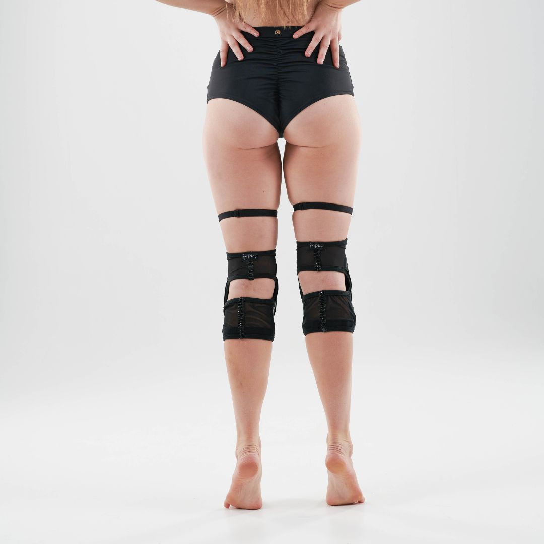 pole dancer in sticky garter kneepads in black