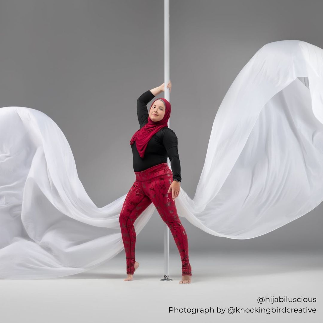 pole dancer in sticky zodiac leggings in red dusk